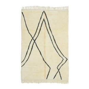 A beige rug adorned with abstract black lines weaving diagonally and finished with fringe on the edges, making a subtle yet stylish statement.