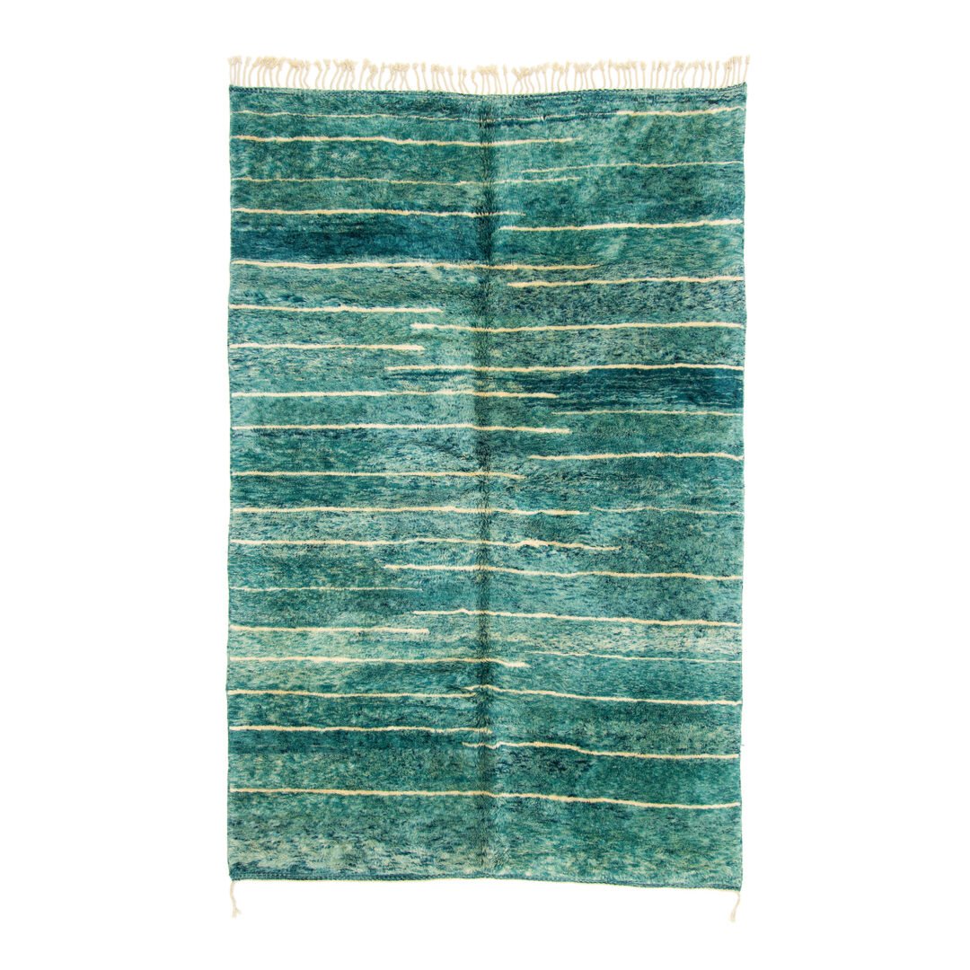 Moroccan rug featuring horizontal stripes in varying shades of teal and cream, creating a textured, oceanic appearance.