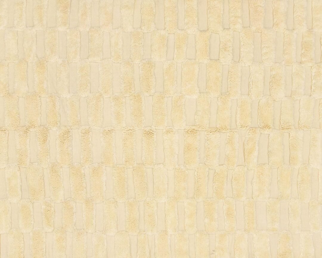 A close-up view of a textured beige fabric showcasing a sophisticated grid-like pattern, perfect for adding an element of elegance to any space.