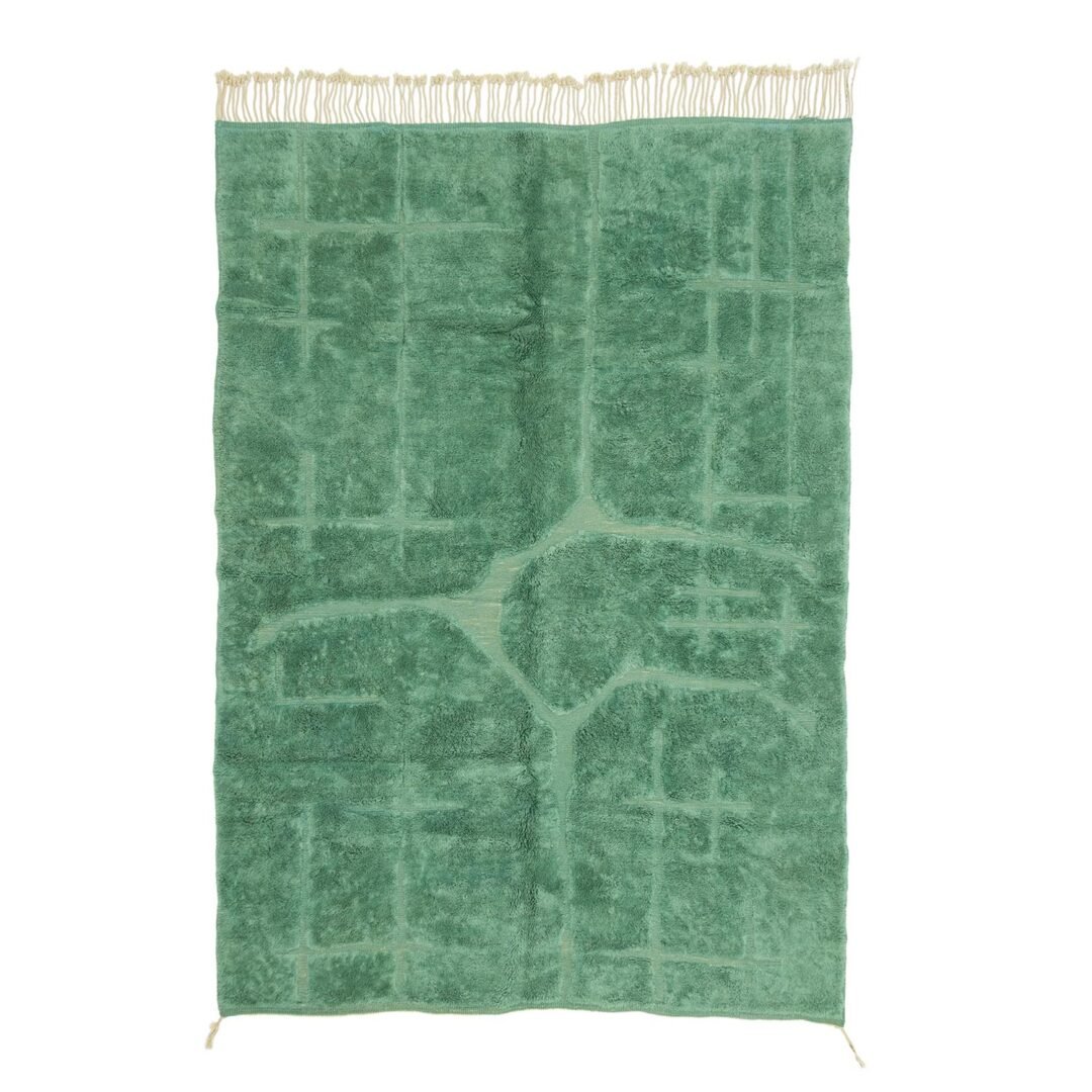 Green Moroccan hand knotted rug featuring a subtle abstract pattern that mimics organic shapes