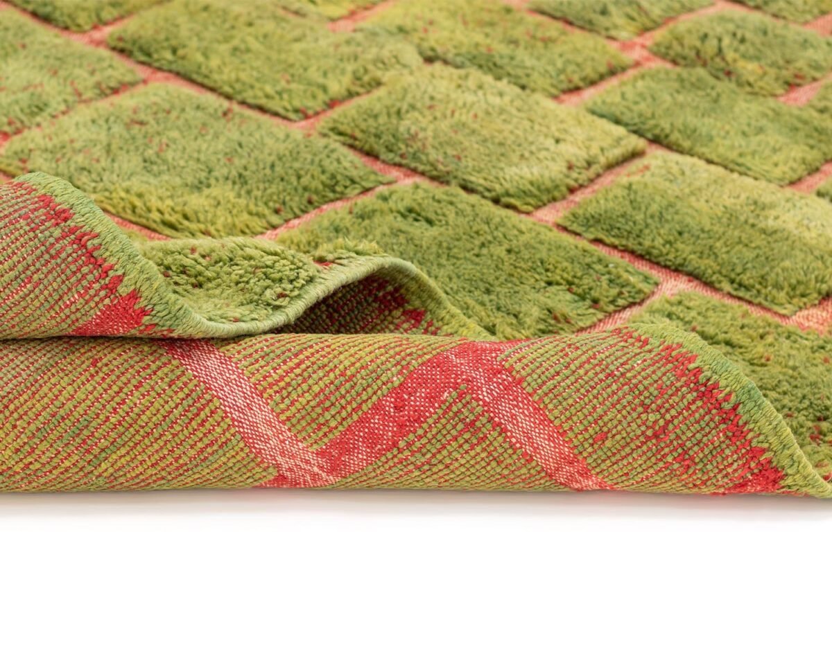 Green Moroccan rug with a textured brick pattern in contrasting red, back detail