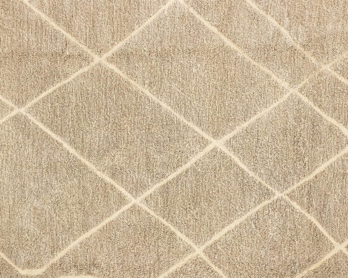 A luxurious, hand-knotted Moroccan rug featuring a beige background adorned with an elegant white diamond pattern.