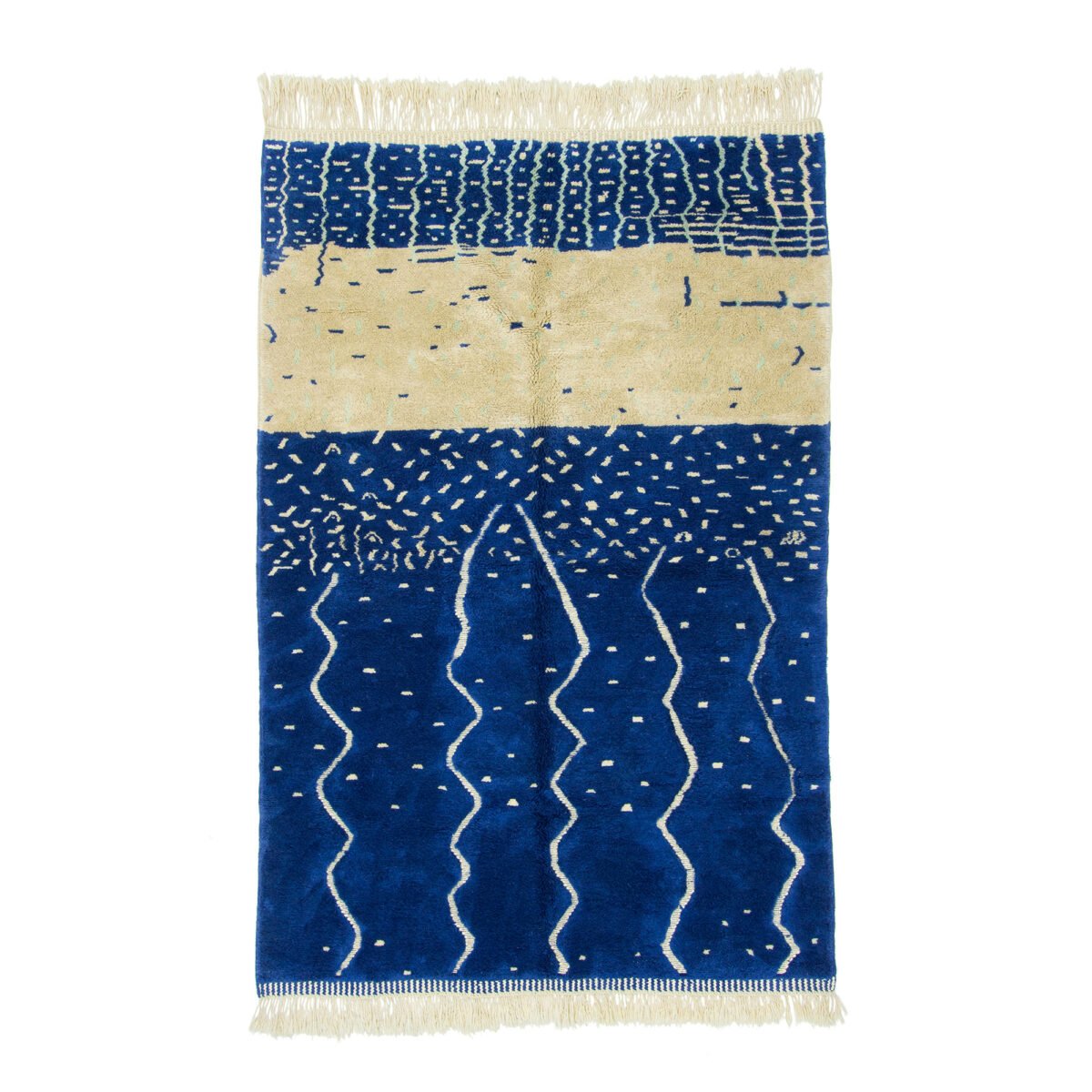 Moroccan rug with a striking abstract design in deep blue and cream, featuring textured patterns and wave-like forms across its surface.