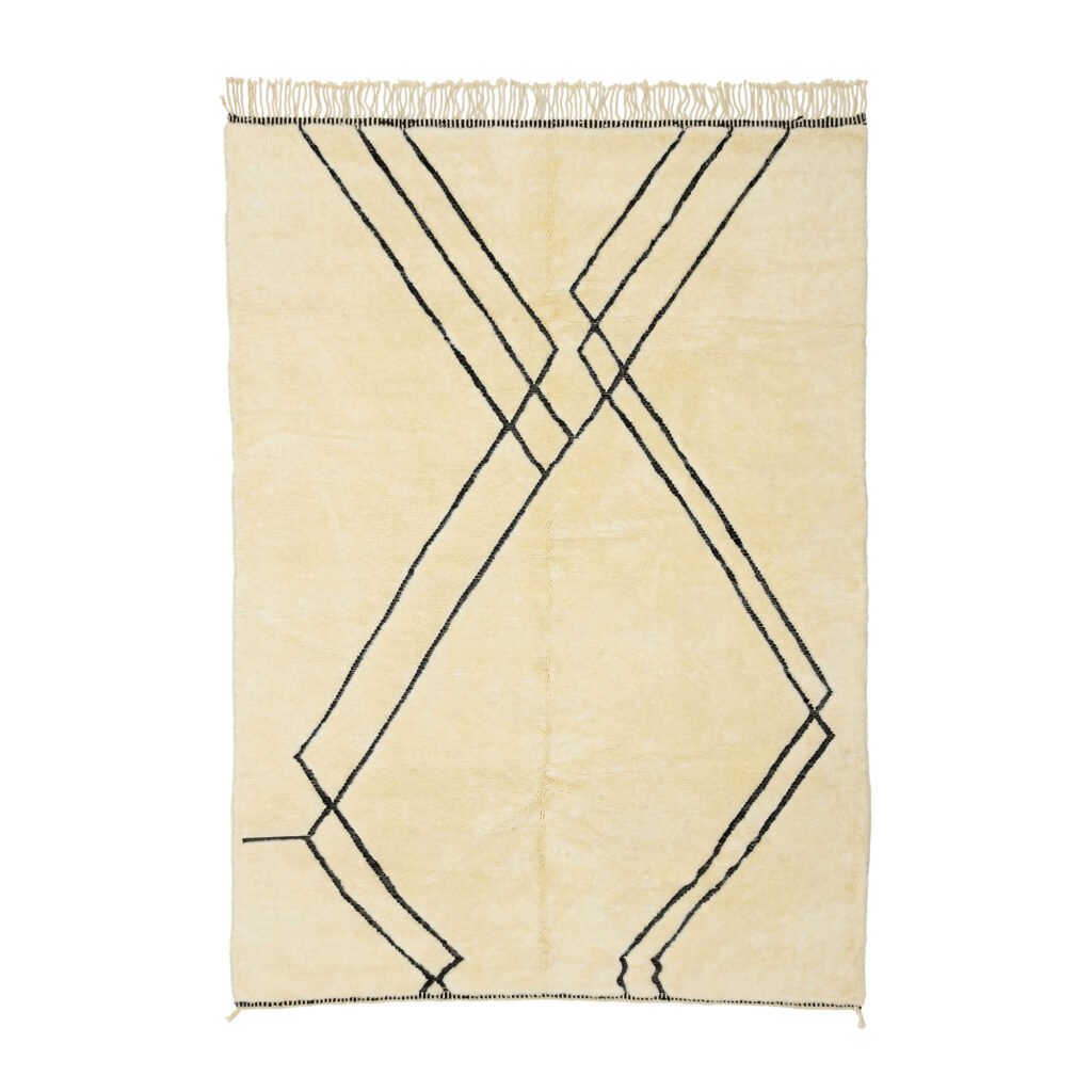 A beige rug adorned with a striking black geometric pattern of intersecting lines, complemented by fringe along the top edge.