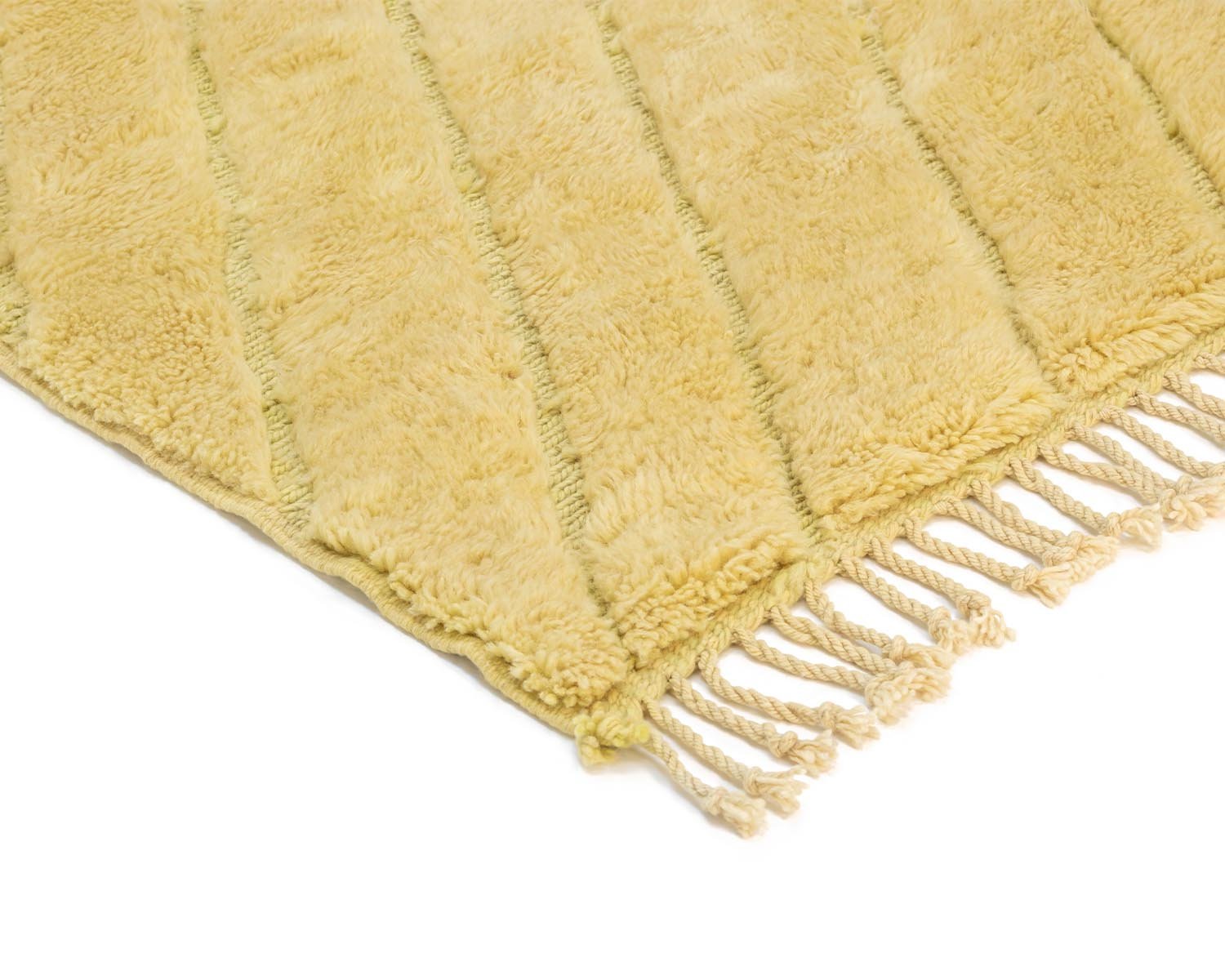 This handmade home decor piece features a yellow rug with a striped texture and fringed edges, offering a touch of elegance to any space.