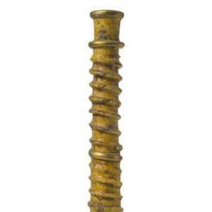 A vertical close-up of a golden, intricately ribbed Tamegroute pottery candlestick holder against a plain white background.