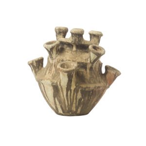 An unglazed Tamegroute pottery vessel, this ancient piece boasts a multi-spouted design with a wide base and numerous tubular openings. Its surface is rough and textured, showcasing the natural clay tones typical of its historical craftsmanship.