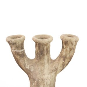 An ancient, three-branched, unglazed Tamegroute pottery vase with a weathered texture stands proudly against a plain white background.