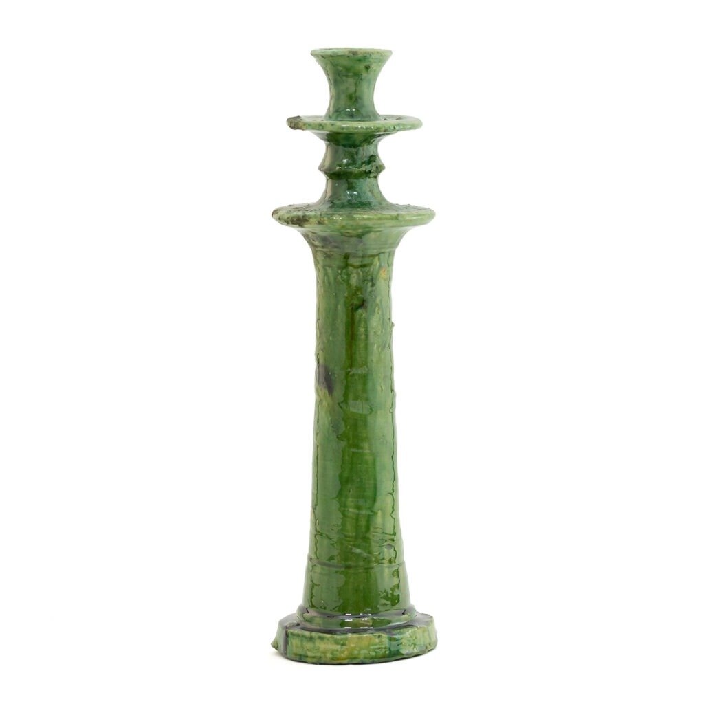 Green ceramic candlestick crafted in the style of Tamegroute pottery, featuring a textured surface and a tiered design that tapers elegantly toward the top, set against a plain white background.