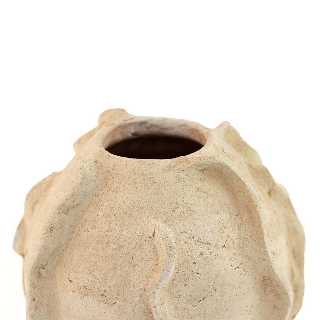 This rough, spherical ceramic vase, reminiscent of unglazed Tamegroute pottery, features an irregular wavy surface and a round opening, giving it a rustic and unfinished appearance.