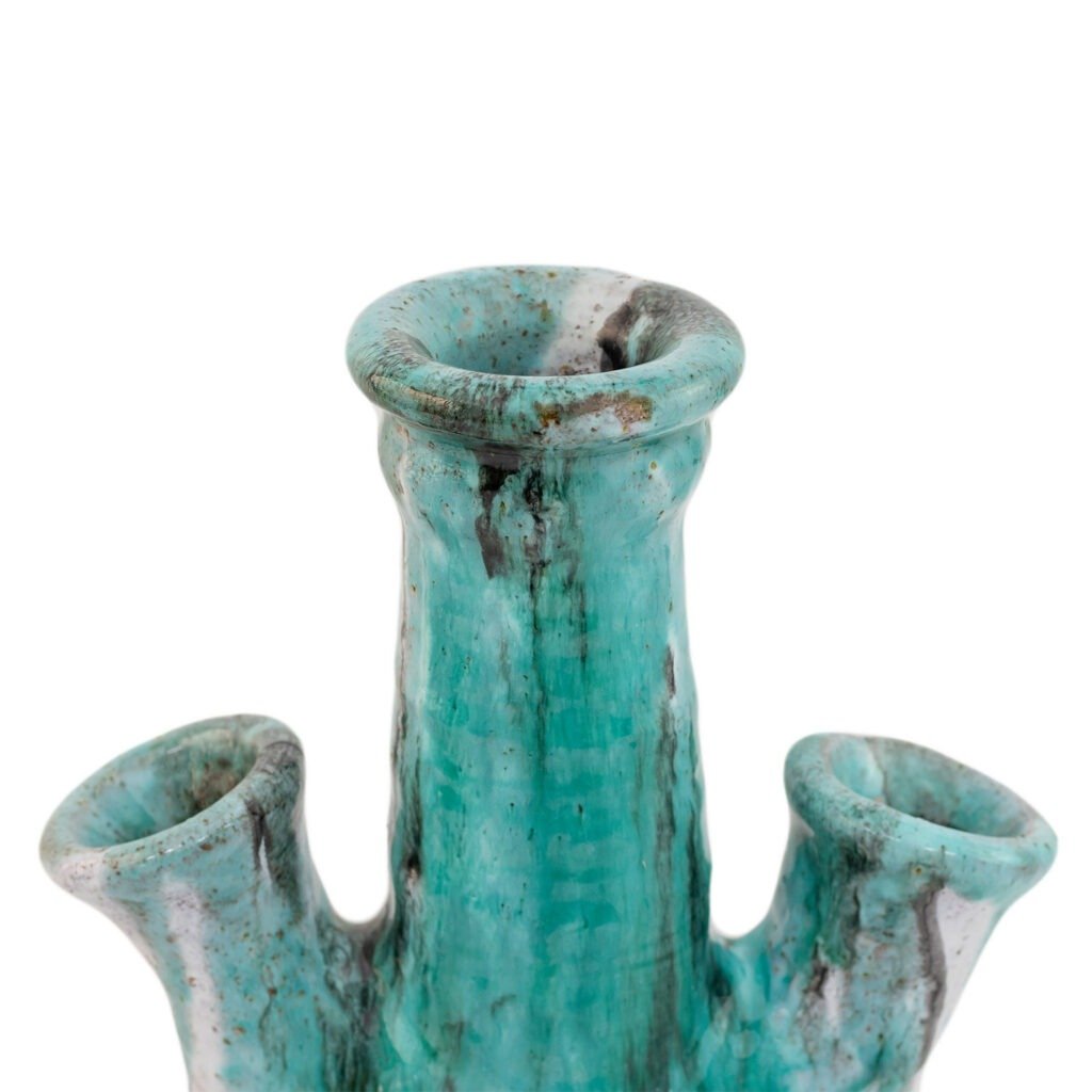A turquoise ceramic vase inspired by Tamegroute pottery, featuring four flared openings and a speckled finish, with a vertical ribbed texture.