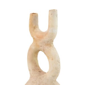 This handmade ceramic sculpture, in a soothing cream hue, features a hollow center and two parallel cylindrical projections at the top, making it a timeless piece of home decor against its pristine white backdrop.