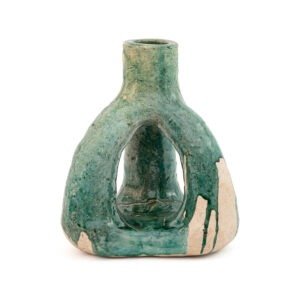 A handmade ceramic sculpture inspired by Tamegroute pottery, with a hollow center and glazed green and unglazed beige exterior, shaped like an abstract figure.