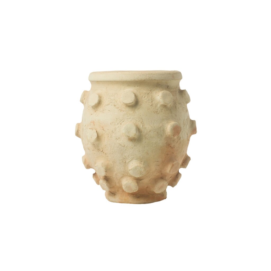 Unglazed Tamegroute pottery clay pot with a textured surface, featuring protruding round knobs and a light beige color.