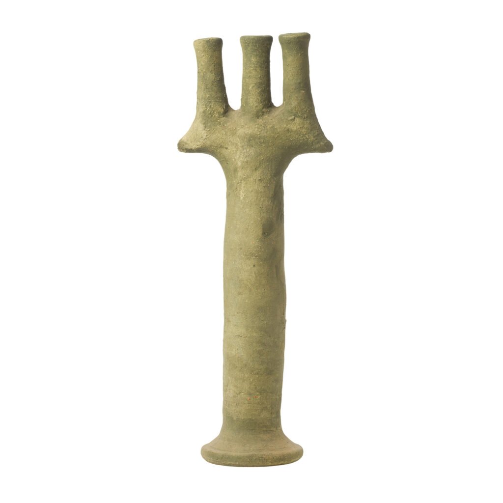 The unglazed Tamegroute pottery-inspired stone sculpture features a trident design, with a cylindrical base and three elegantly pronged tops.
