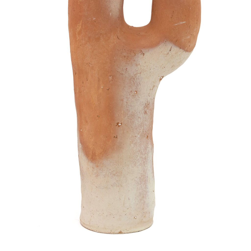 An unglazed ceramic sculpture inspired by Tamegroute pottery, resembling a cactus with a gradient of ochre to beige tones, stands upright against a white background.