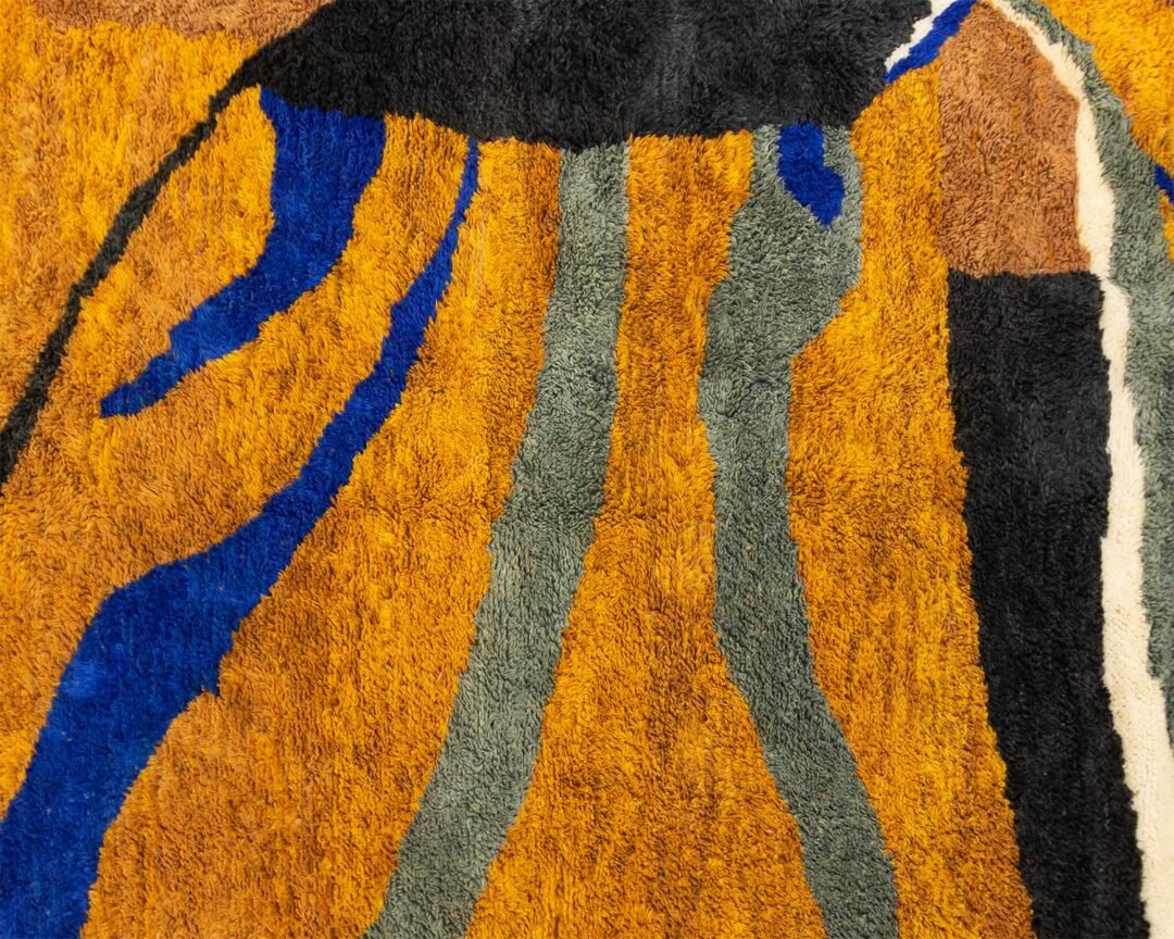 This luxurious, vibrant carpet is a masterpiece of abstract patterns and stripes in orange, blue, green, black, white, and brown. Expertly hand-knotted, its intricate design adds an elegant touch to any space.