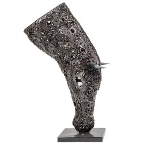 This Metal Stallion sculpture captures the essence of a horses hoof, intricately crafted from various metal gears and mechanical parts. The piece is elegantly mounted on a square base, showcasing its industrial charm and artistry.