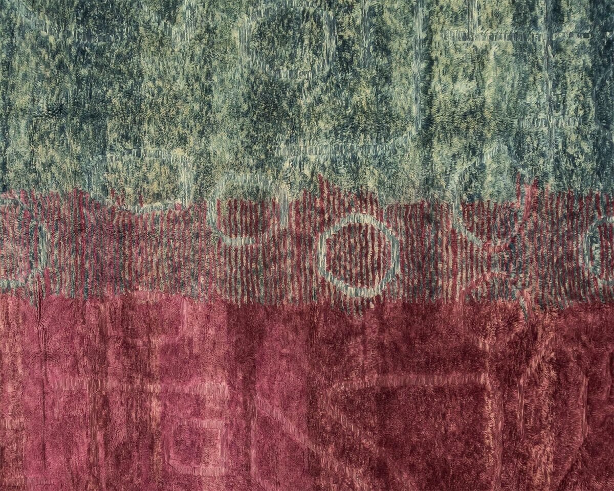 This luxurious rug features an abstract texture with green and red horizontal sections, adorned with circular and linear patterns that evoke the intricate artistry of a hand-knotted design.