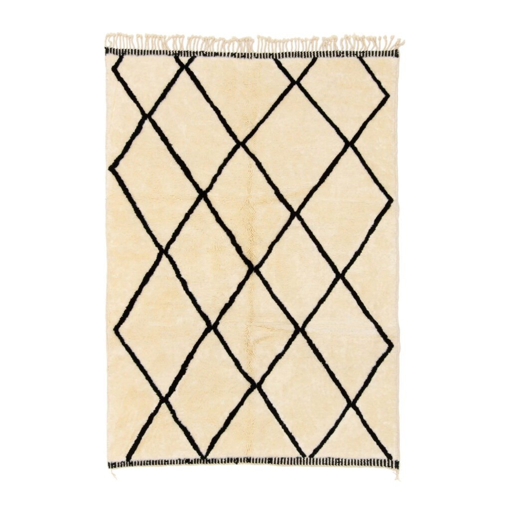 A hand-knotted rug featuring a beige base with a diamond-shaped black grid pattern and fringe along the top and bottom edges.
