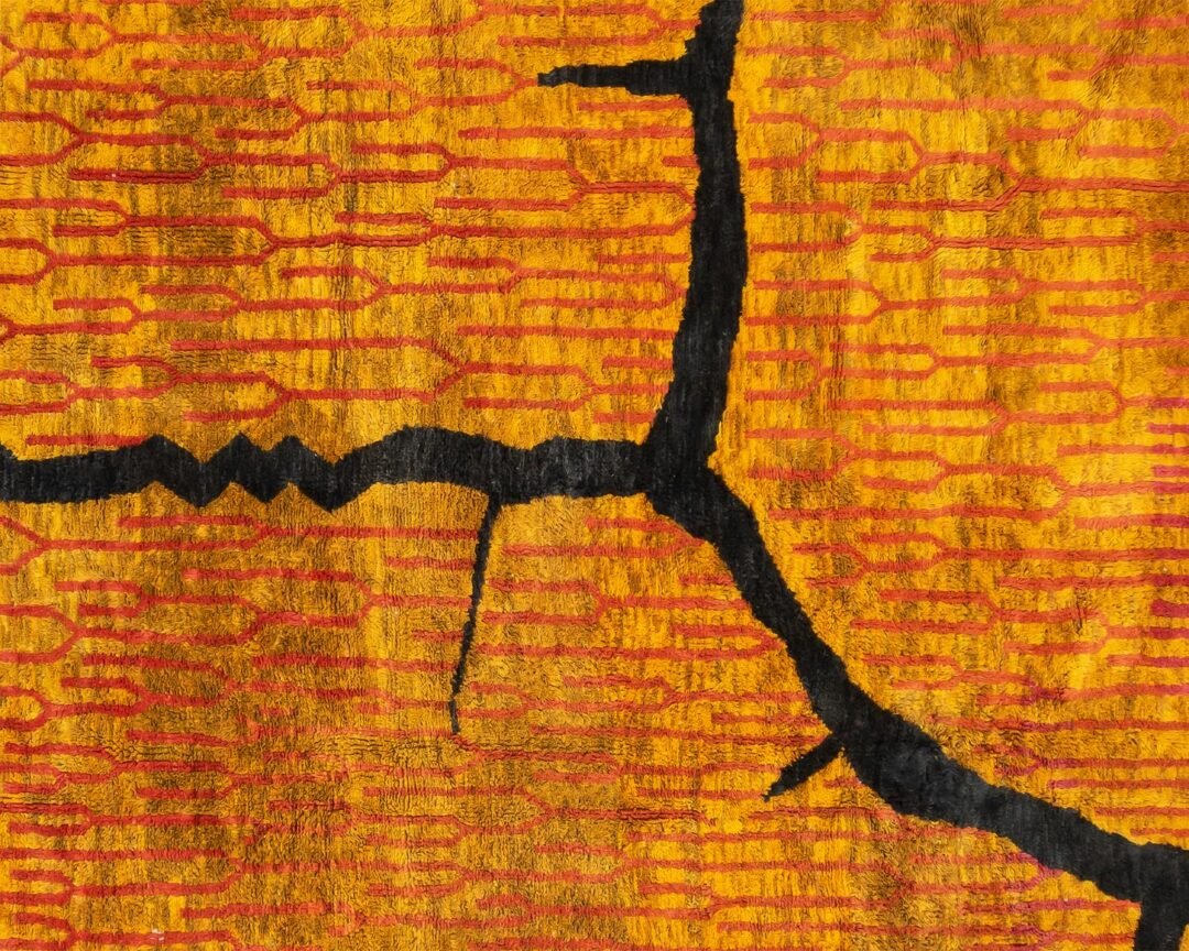 This abstract artwork presents bold, jagged black lines and geometric patterns against an orange and yellow backdrop. Perfect for those seeking handmade home decor, it inspires the same elegance found in luxury rugs, offering a sophisticated touch to any living space.
