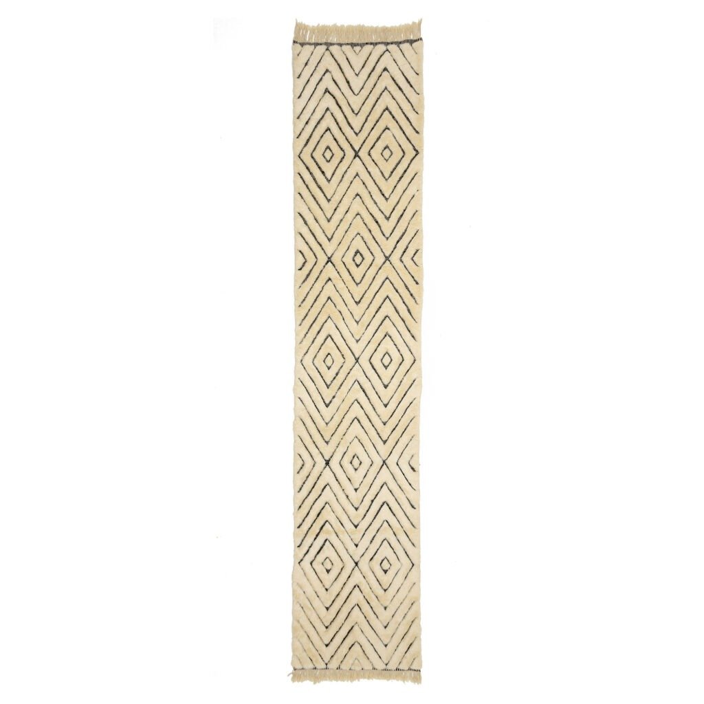 A chic, narrow rug featuring a cream background and an eye-catching geometric diamond pattern in black, perfect for adding a touch of sophistication to any room.