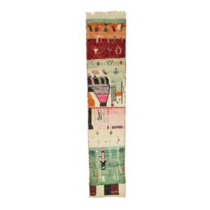 A vibrant tapestry showcases abstract geometric patterns on a slender strip of fabric, set against a white backdrop. Its multicolored design captures attention and adds artistic flair to any space.