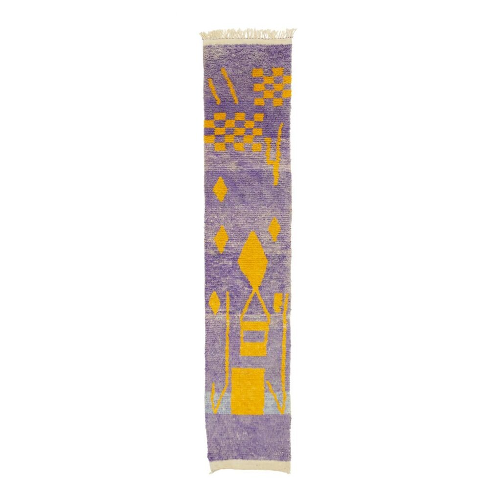 This rectangular rug showcases striking abstract yellow geometric patterns set against a rich purple backdrop, adding a modern and vibrant touch to any room.