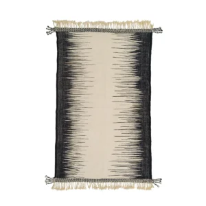 A flatweave rug with a central ivory band flanked by black, jagged edges, resembling sound waves. The rug is adorned with fringes on the shorter sides.