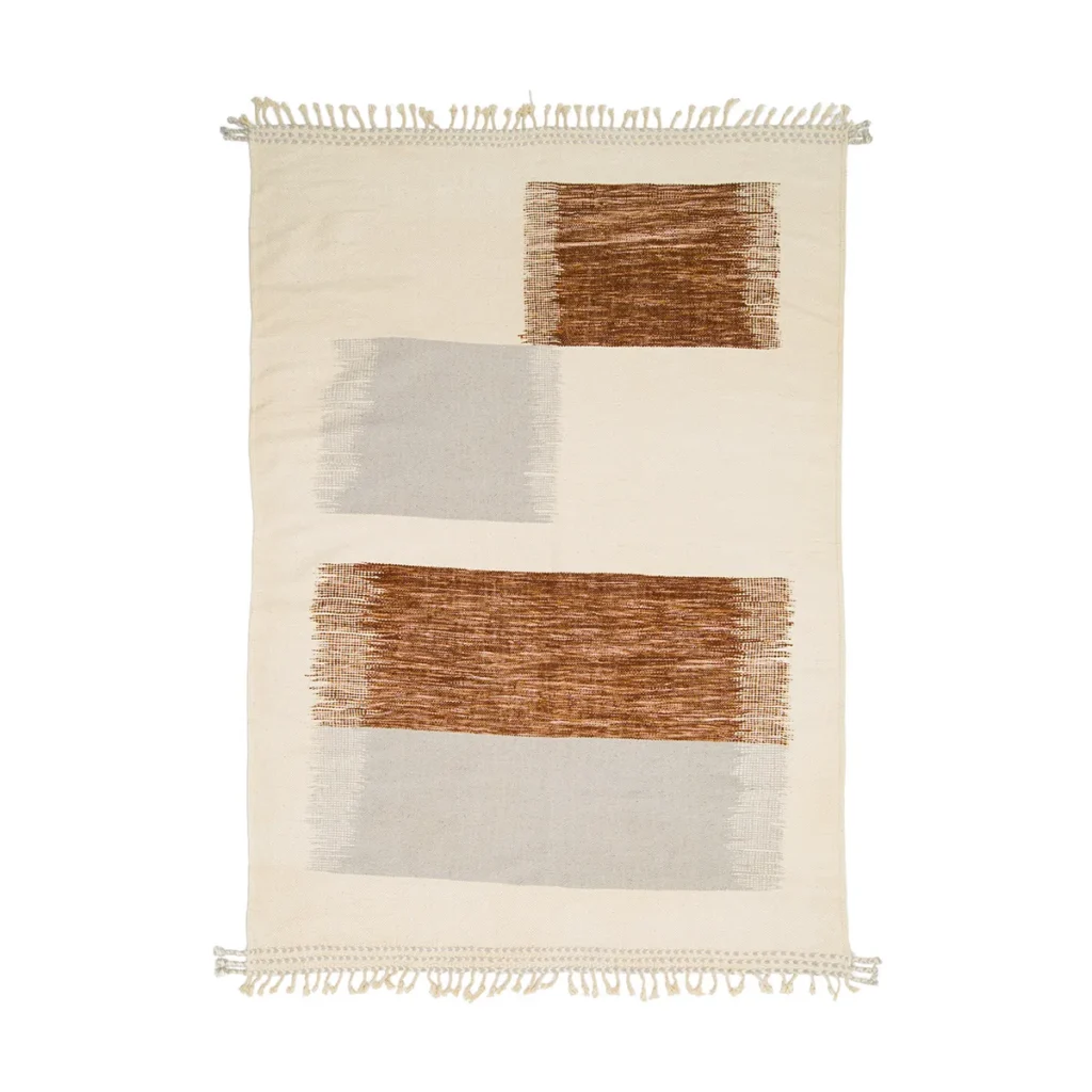 This rectangular rug features elegant tassels on its short edges, showcasing two brown and one gray rectangular pattern set against a cream background. Perfect for adding a touch of sophistication to any room.