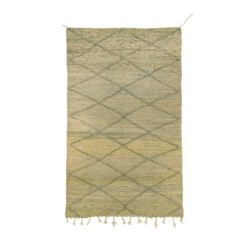 This beige and green handwoven rug features a stylish diamond pattern with fringe on one end, adding a touch of elegance to any room.