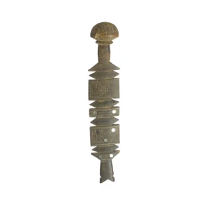 An antique, ornate metal object with a textured surface and geometric shapes, reminiscent of vintage craftsmanship. Its rounded top and multiple horizontally-aligned sections echo the elegance of vintage wooden tent pegs.