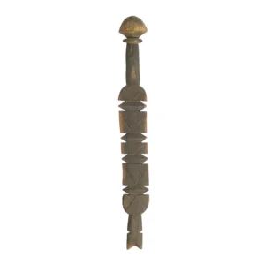 A carved wooden sculpture with abstract geometric shapes, reminiscent of vintage wooden tent pegs, stands upright.