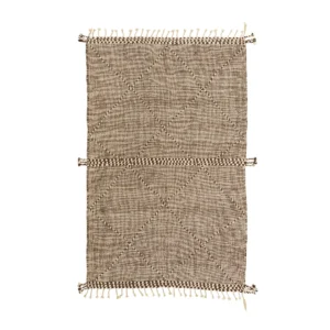 A beige woven rug with a diamond pattern and fringed edges adds subtle elegance to any space.