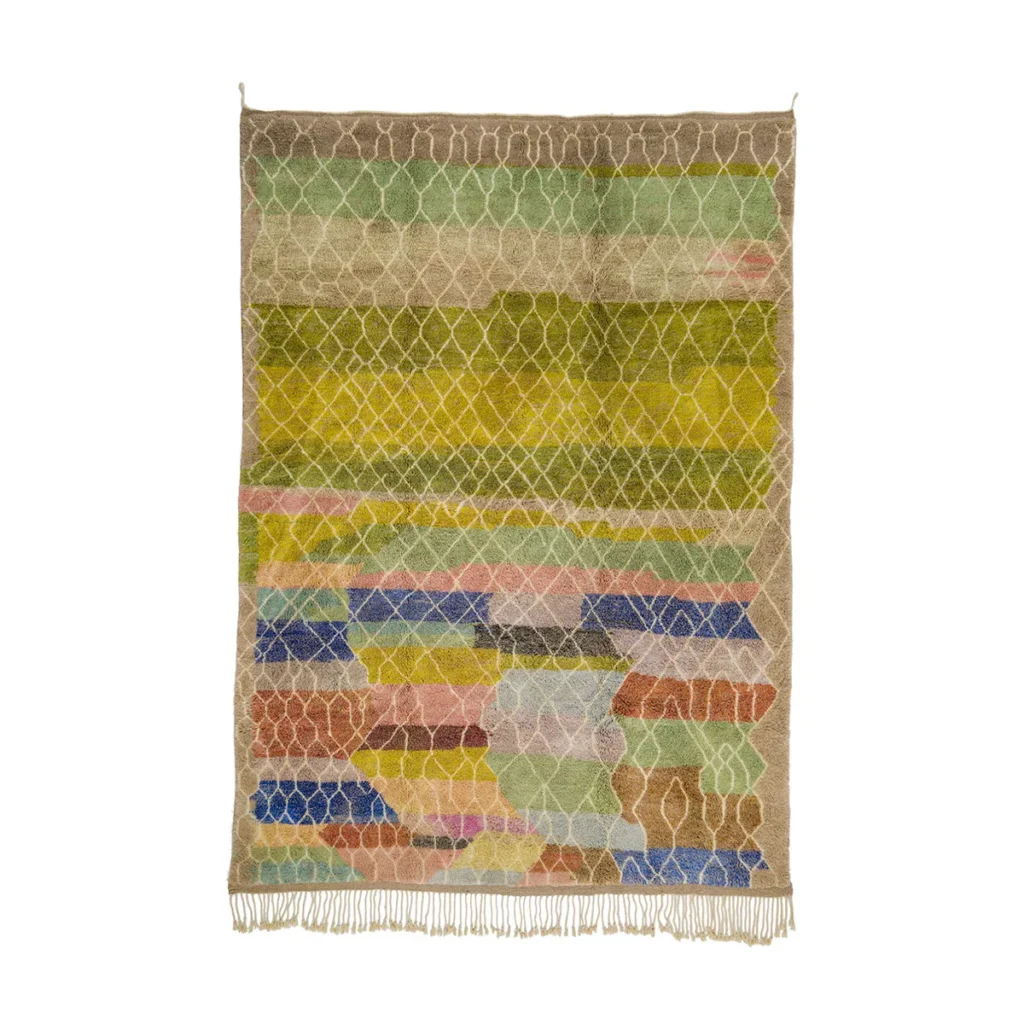 Experience the elegance of a hand-knotted rug with a colorful abstract geometric pattern. Featuring earthy and vibrant tones like green, yellow, brown, blue, and pink, this luxurious piece is finished with fringe at the bottom edge.