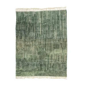 A hand-knotted green textured rug featuring a vertical line pattern and fringe on the edges, showcasing an Authentic Moroccan Rugs exquisite craftsmanship.