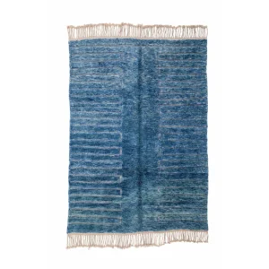 This luxurious blue textured rug features a striking striped pattern and elegant fringe on the shorter sides, adding a sophisticated touch to any room. Hand-knotted with precision, its an exceptional choice for those seeking both style and quality in their home decor.