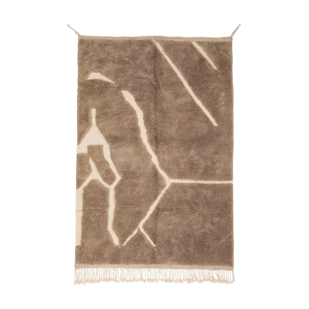 This luxurious, hand-knotted rug features a brown and beige geometric pattern with fringe edges, elegantly displayed against a white background.