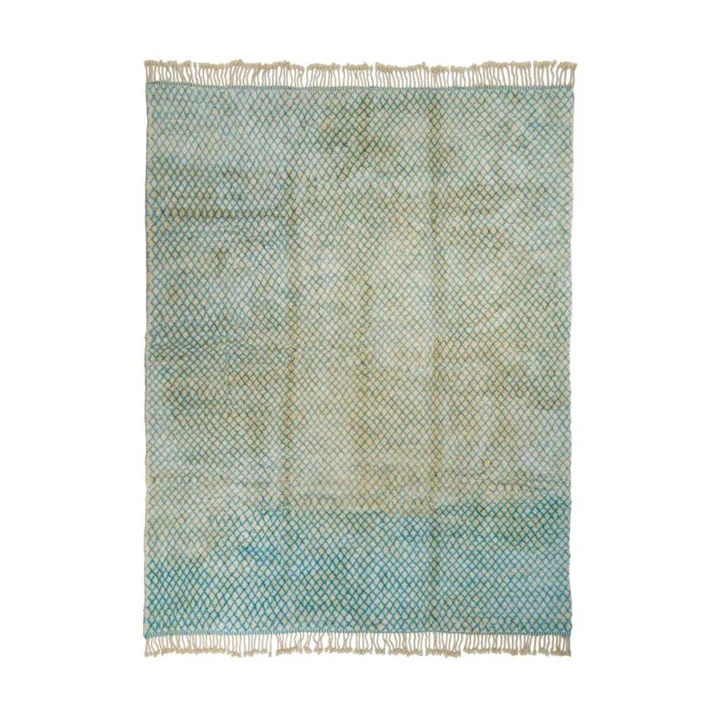 A textured rug with fringed edges, showcasing a gradient pattern that transitions from green to blue and includes a subtle diamond mesh overlay. Perfect for adding an artistic touch to any room.