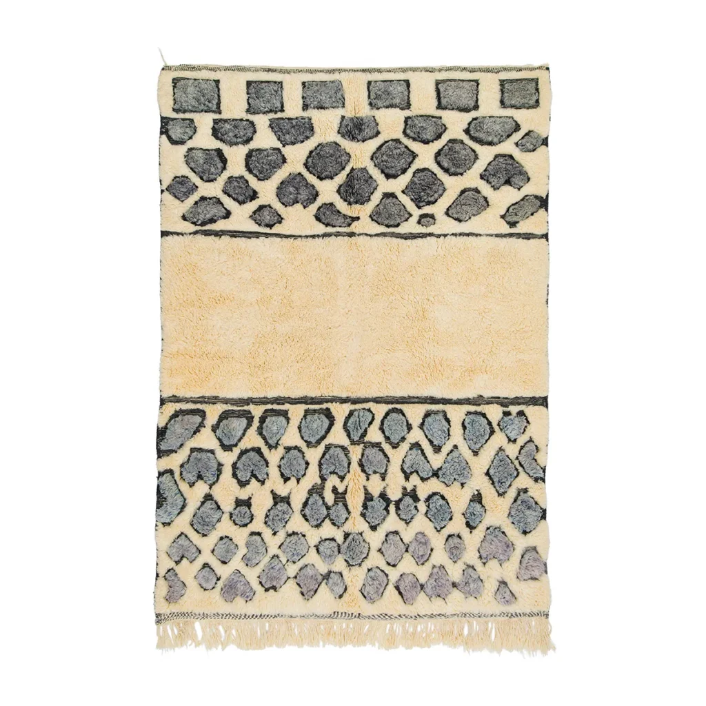 Discover this luxurious hand-knotted Moroccan rug in beige and black, featuring a stunning geometric pattern. Its textured center and elegantly fringed edges add sophistication and style to any space.
