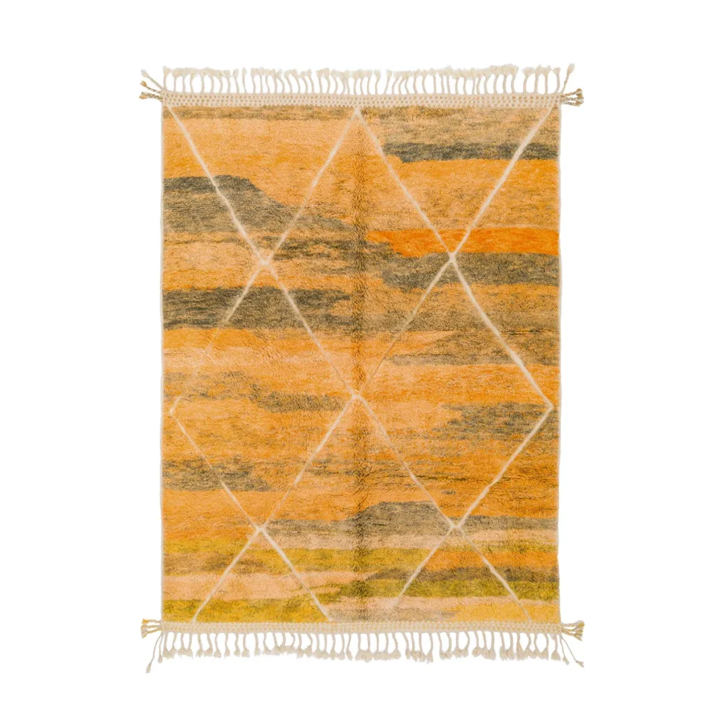 This luxurious hand-knotted rectangular wool rug showcases an abstract pattern in vibrant orange, yellow, and brown with intricate diamond shapes, complemented by elegant fringe on the shorter sides.
