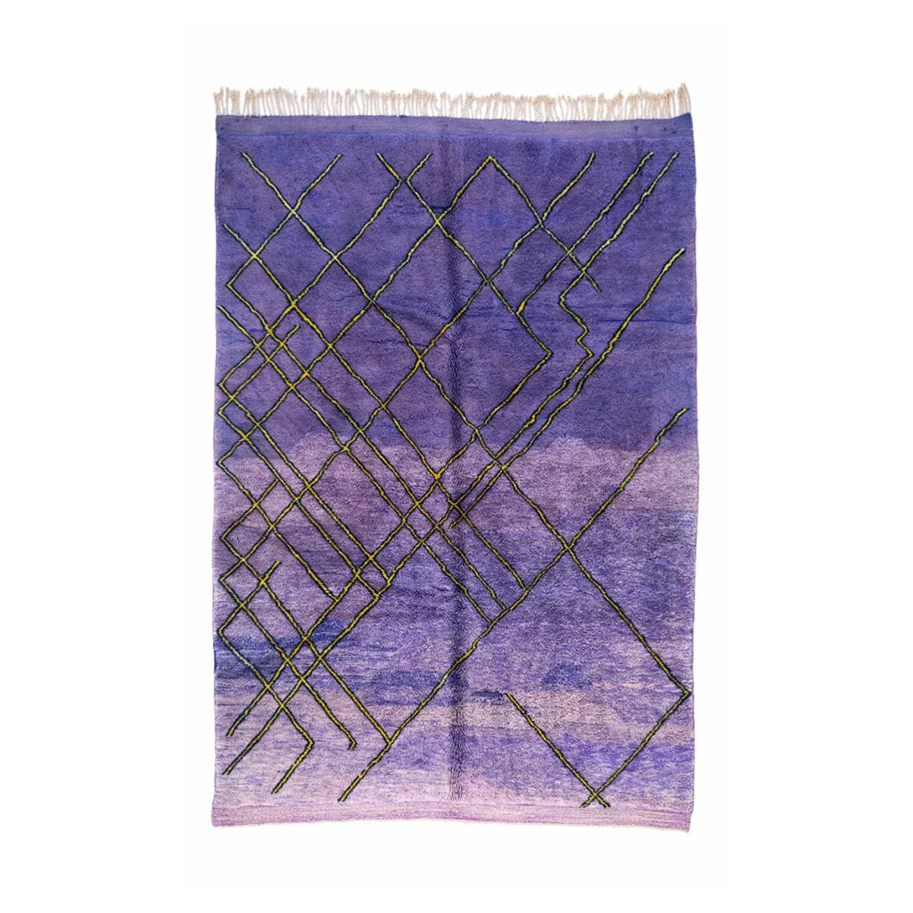 Experience the elegance of this luxury, hand-knotted rug in shades of purple and blue, adorned with fringed edges. Its intersecting dark green line pattern adds a sophisticated touch to any space.
