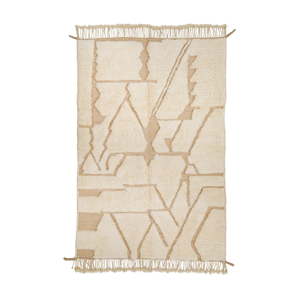 This luxurious rectangular beige rug features intricate geometric patterns and fringed edges, epitomizing the elegance of hand-knotted craftsmanship.