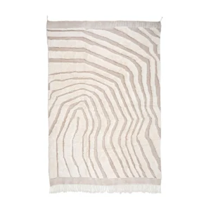 This luxurious, beige and white rug boasts an abstract wavy line pattern and hand-knotted craftsmanship, complete with fringed edges at the bottom.