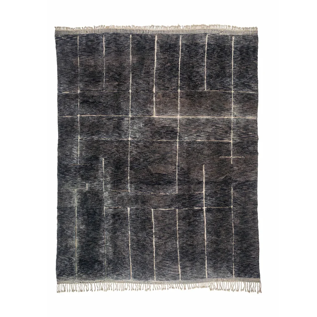 This artisanal rug features a dark woven design with a geometric pattern of intersecting rectangles and light fringed edges on a white background. Hand-knotted for added authenticity, it brings an essence of authentic Moroccan style to your space.