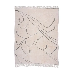 This luxury rug, hand-knotted in a creamy hue, features abstract gray branch-like lines and minimal fringe along the edges.