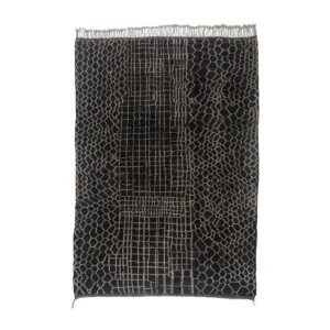 This luxury rug is a rectangular black and gray masterpiece with a woven grid and honeycomb pattern, enhanced by fringe on the shorter sides.