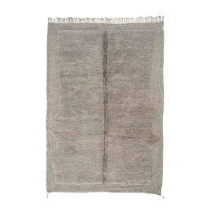 This luxurious hand-knotted rug features a large gray and beige rectangular design with a textured surface and fringed edges.
