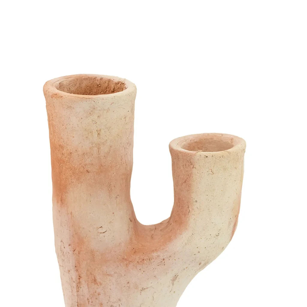 Ceramic sculpture resembling a branching coral, with two cylindrical openings and a textured, beige surface.