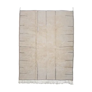 Luxurious hand-knotted beige area rug featuring subtle gray lines and a textured surface, with fringe on the shorter edges, set against a pristine white background.